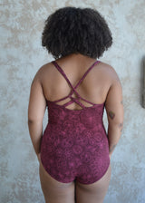 Las Flores Bodysuit - organic cotton bodysuit with cross back straps and beautiful floral print